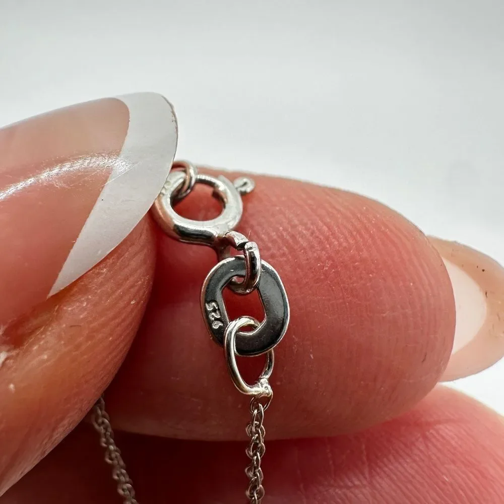 Genuine 1.5ctw tanzanite and‎ CZ accent heart necklace in sterling silver!